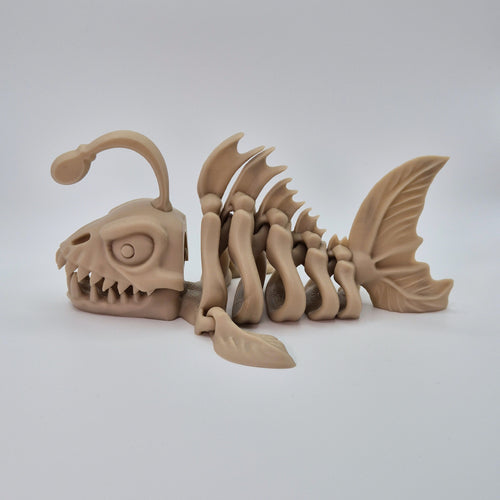 Side view of a bone-coloured 3D-printed articulating skeleton Anglerfish toy