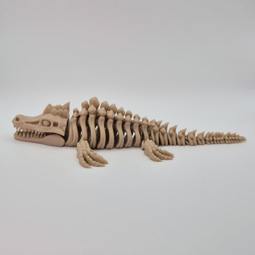 Side view of a bone-coloured 3D-printed articulating skeleton Mosasaurus toy