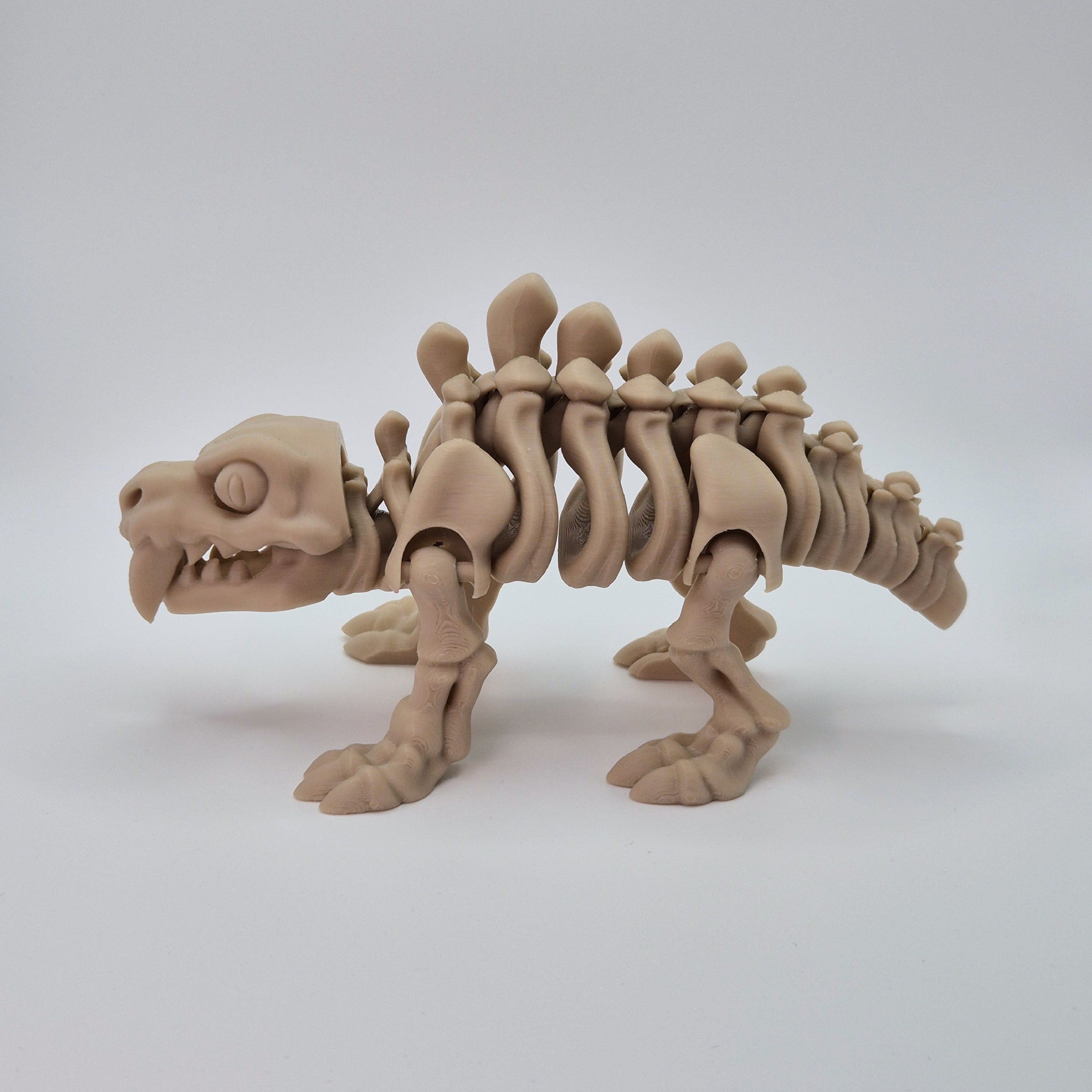 Side view of a bone-coloured 3D-printed articulating skeleton Sabre-toothed Tiger toy