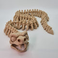 Front view of a bone-coloured 3D-printed articulating skeleton Snake toy