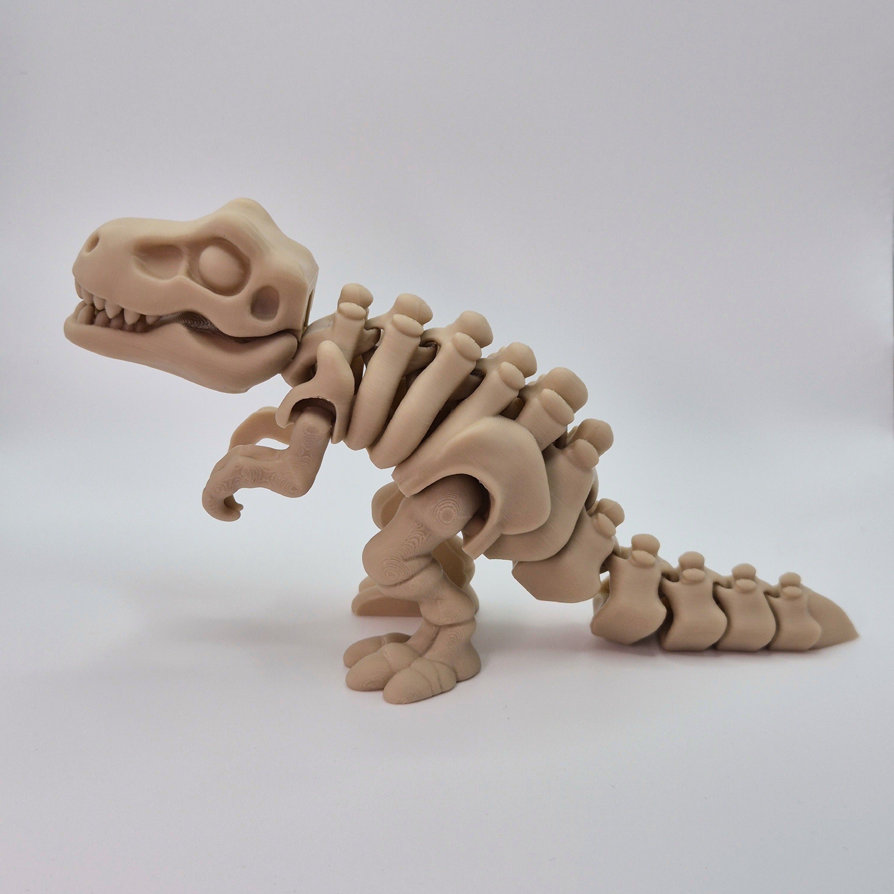Side view of a bone-coloured 3D-printed articulating skeleton Tyrannosaurus Rex toy